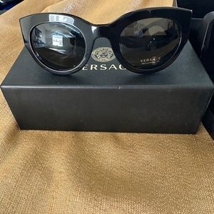 Women’s black Versace sunglasses